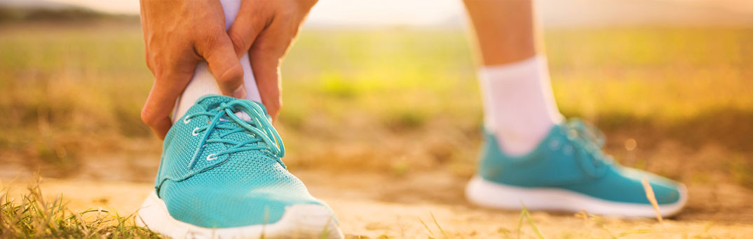 Runner touching ankle.
