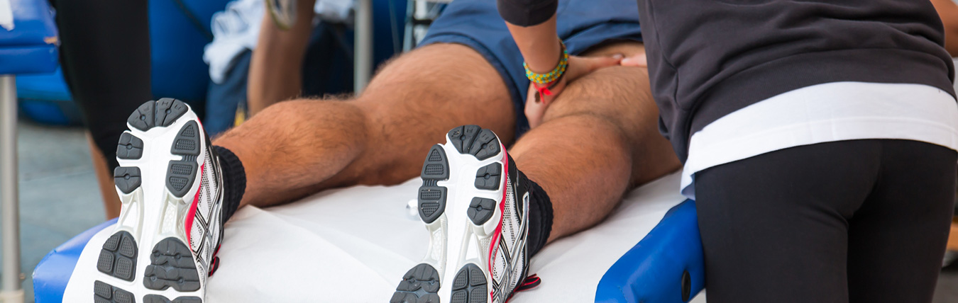 Man getting leg massaged.
